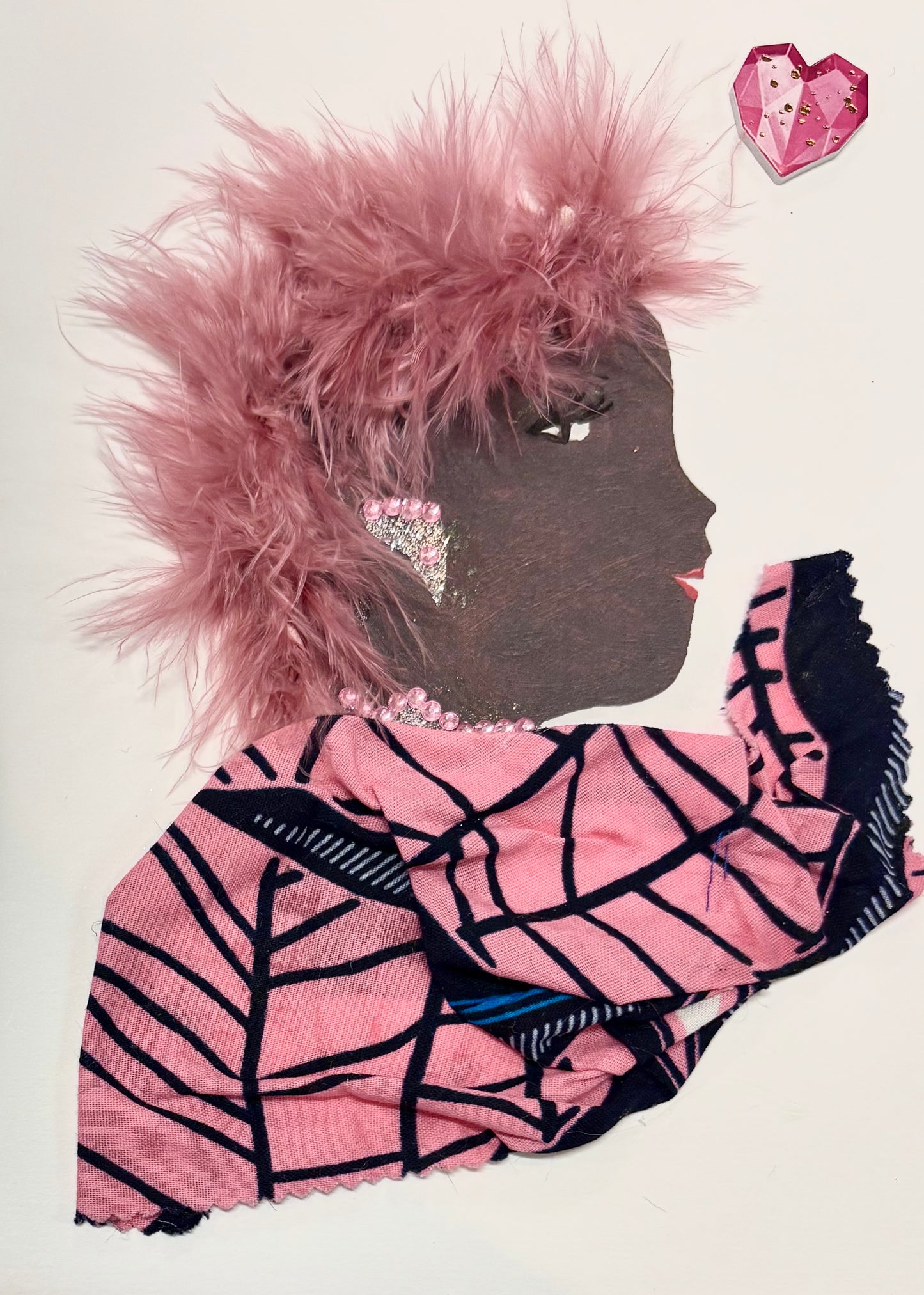 A woman has blush pink hair and wears a pink blouse. The blouse has a black geometric striped pattern. She wears sparkling silver jewellery with pink gems. In the upper right corner, there is a pink heart.