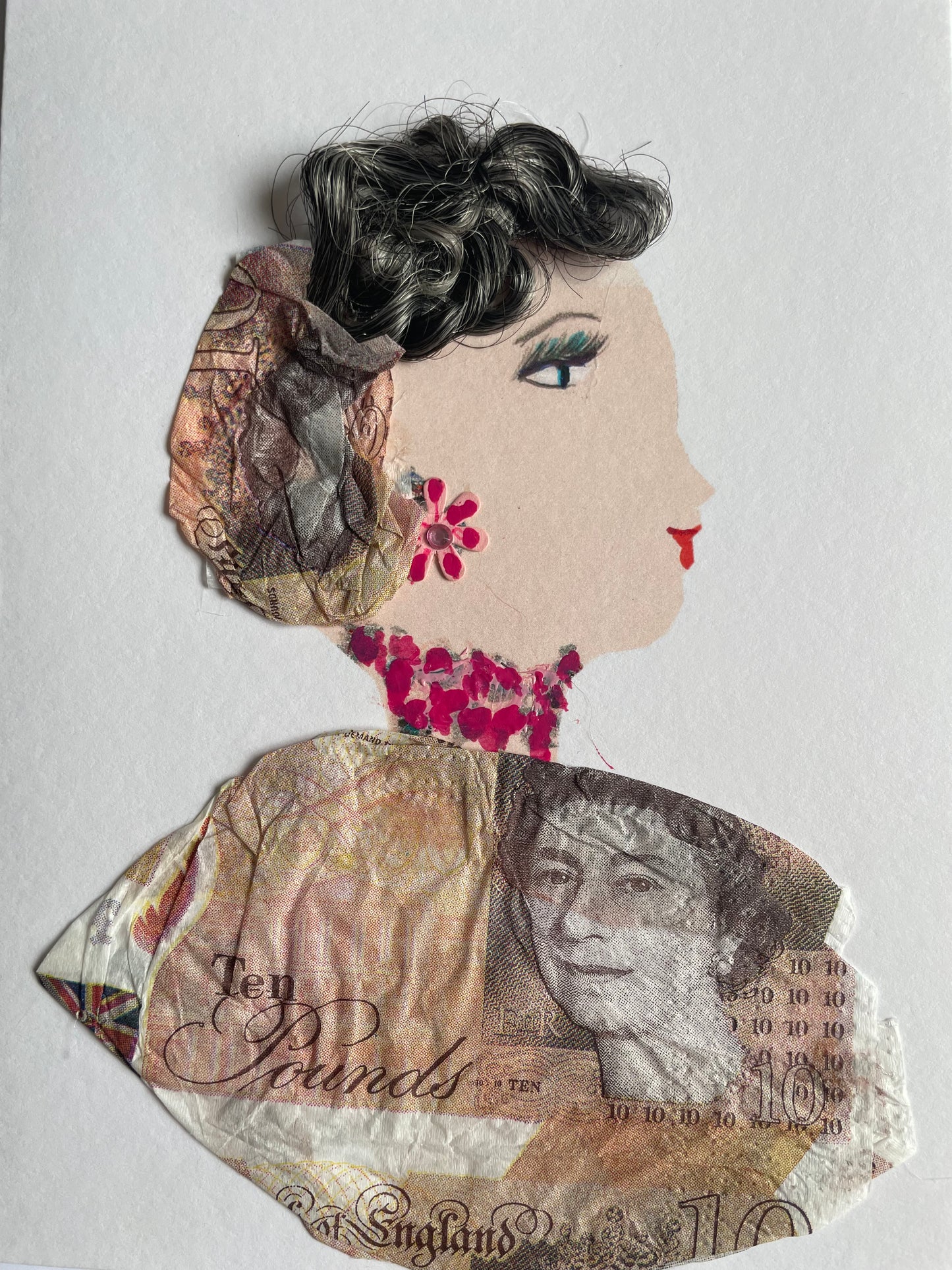 I designed this card for a woman named Westminster Mary. She is wearing a matching blouse and hat that are made out of ten pound notes. She also wears red floral jewelry as accessories.