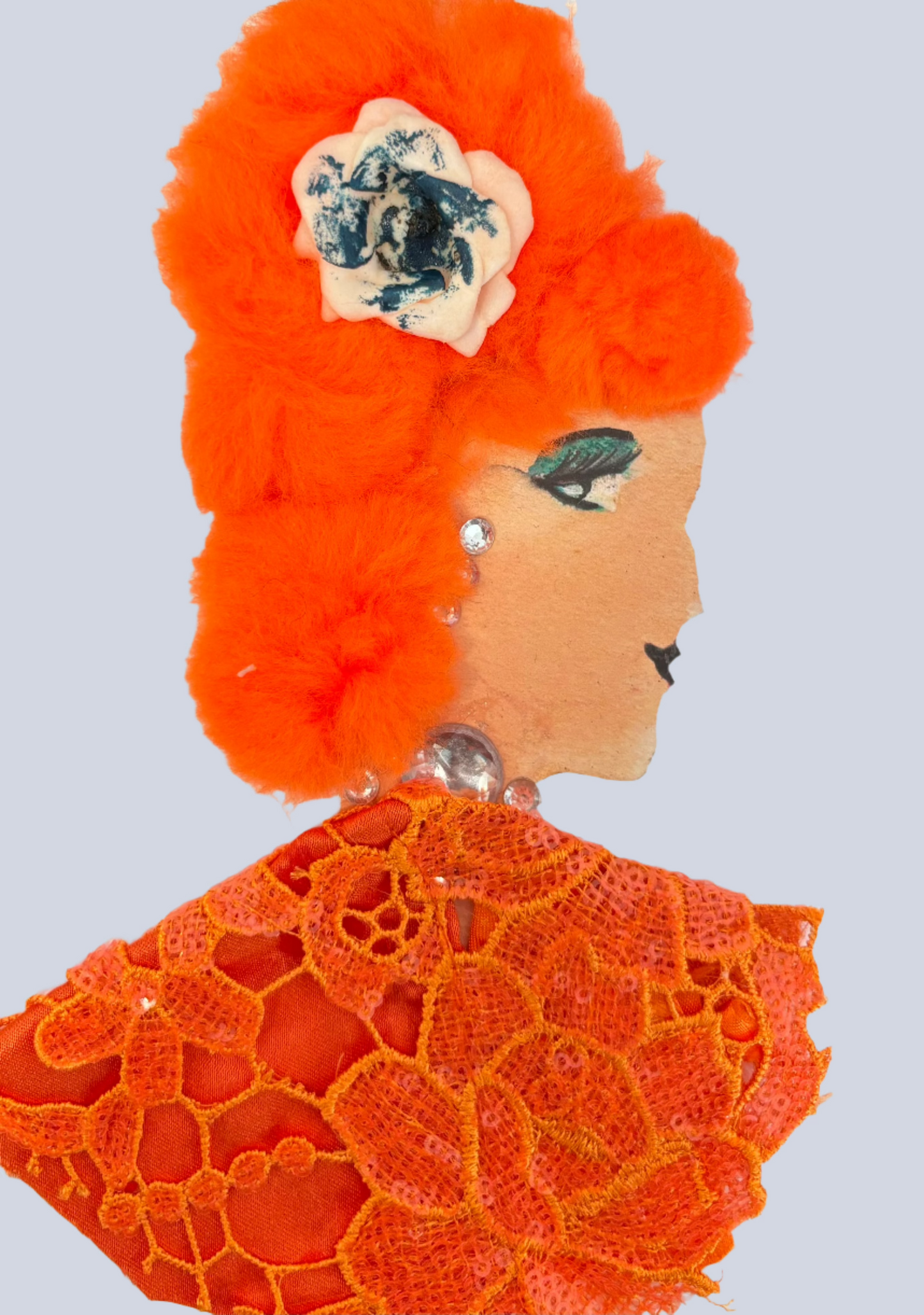 This card is designed for a woman named Marble Arch Molly. She is wearing an orange sequin top with a flower pattern on it. She has neon orange hair that has a white and blue flower in it. She is wearing silver jewellery.