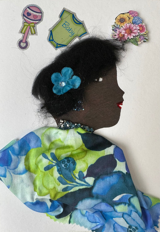 I made this handmade card of a woman named Bayswater Barbra. She is wearing a blue and light green floral blouse with a matching blue flower in her hair. The surrounding space contains baby stickers and flowers.