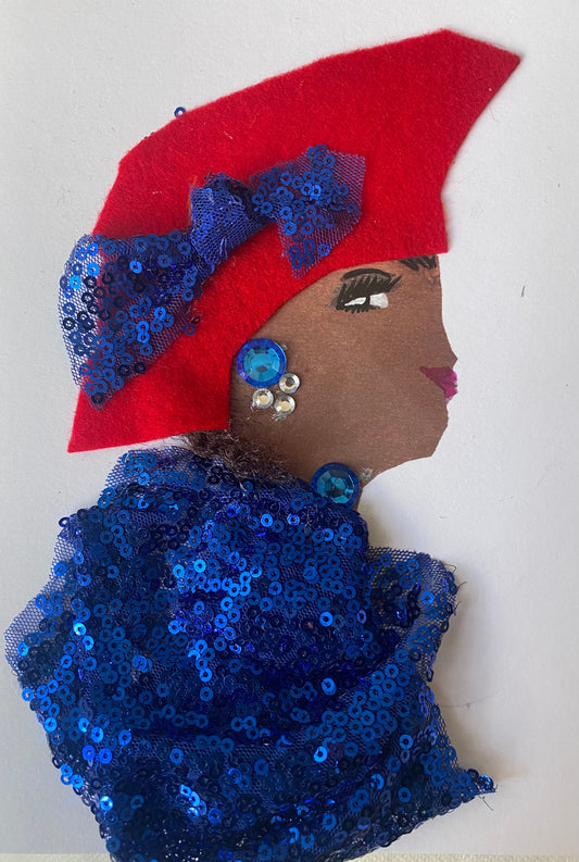 I designed this card of a woman named Everly Envious. She is wearing a red hat with a blue sequence bow on the side. She is wearing a blue sequence blouse. She is wearing blue and silver jewellery.