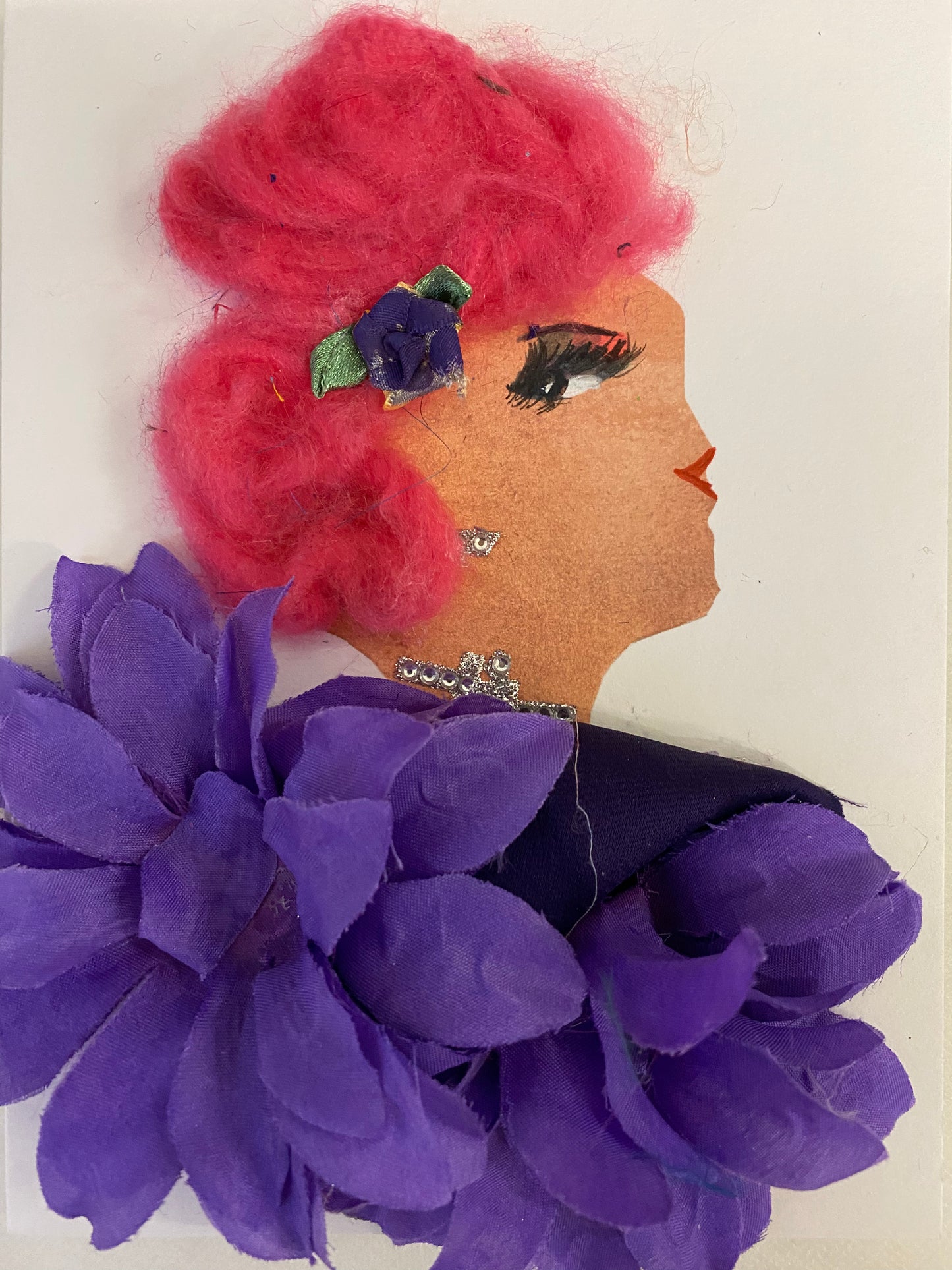 I designed this card of a woman named Heather Heart. She is wearing a stunning purple floral clip in her hair. She wears a gorgeous purple petal blouse. She wears shimmery silver jewellery. 